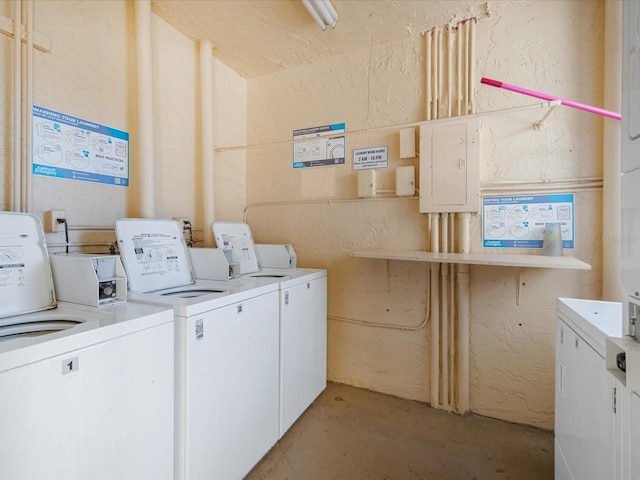 washroom featuring electric panel and independent washer and dryer