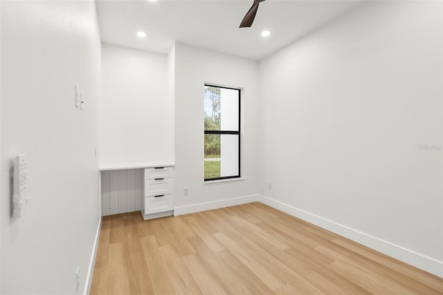 unfurnished bedroom featuring ceiling fan and light hardwood / wood-style flooring