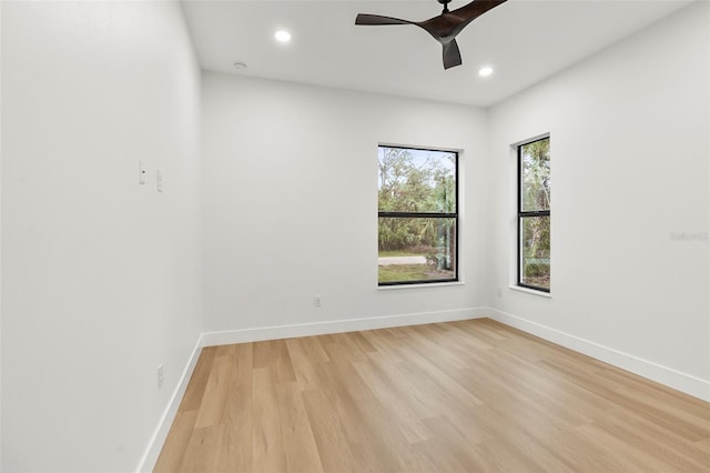 unfurnished room featuring light hardwood / wood-style flooring and ceiling fan