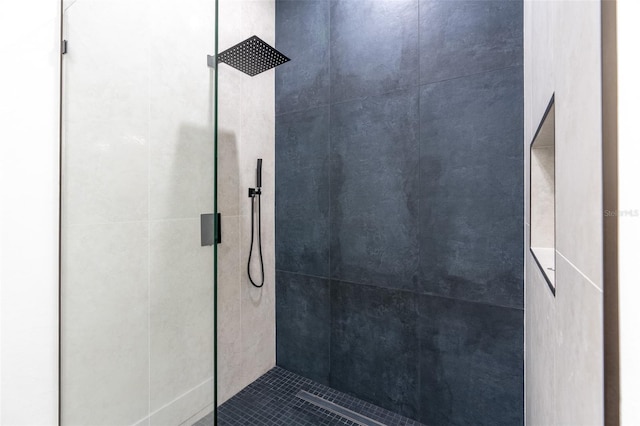 bathroom with tiled shower