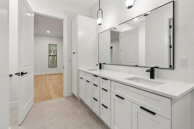 bathroom featuring tile patterned floors and vanity