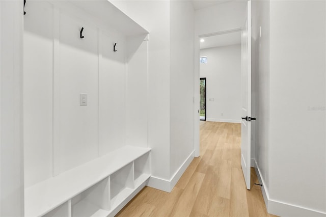 mudroom with light hardwood / wood-style flooring