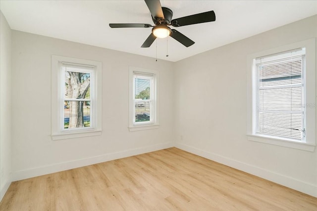 unfurnished room featuring light wood-type flooring and ceiling fan