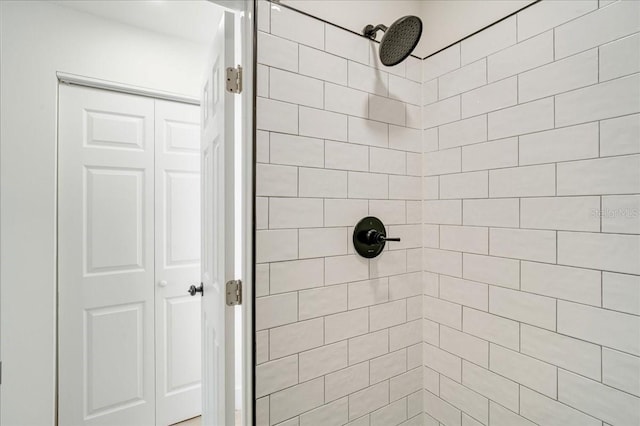 bathroom with tiled shower