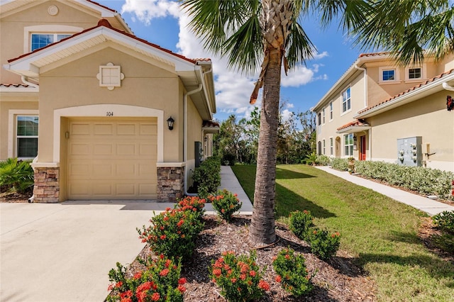 view of front of home featuring a garage and a front lawn