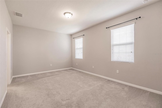 empty room featuring carpet floors