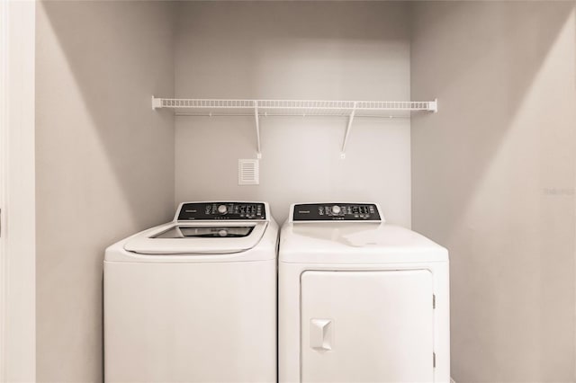 laundry area featuring independent washer and dryer