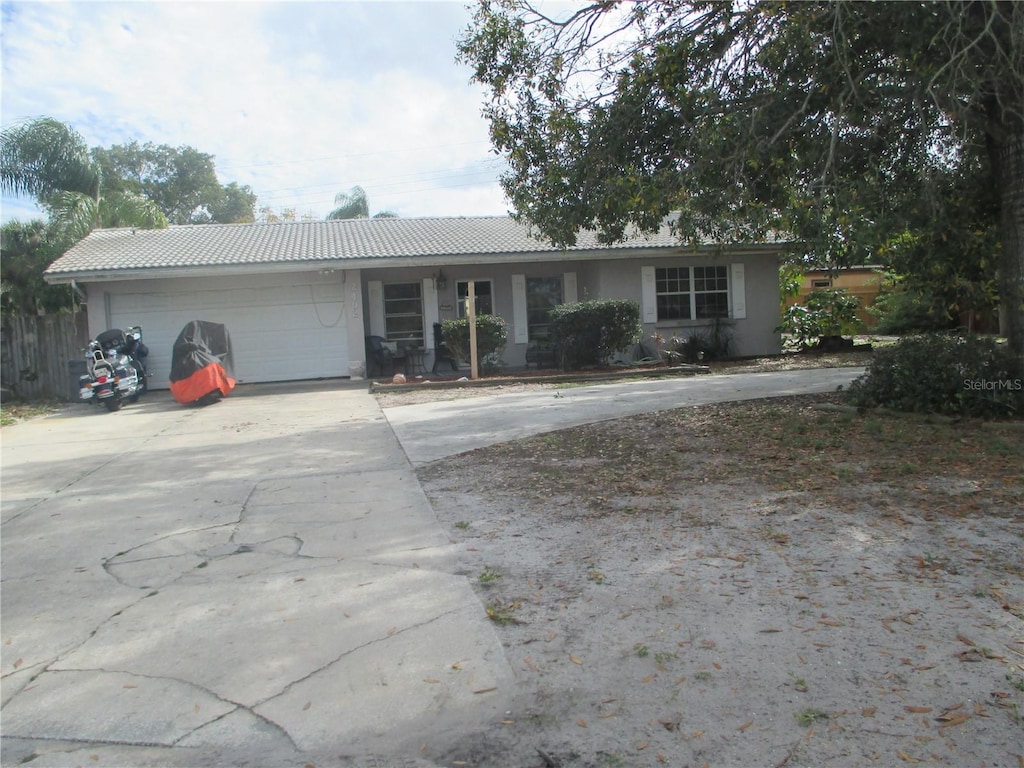 single story home featuring a garage