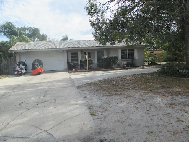 single story home featuring a garage