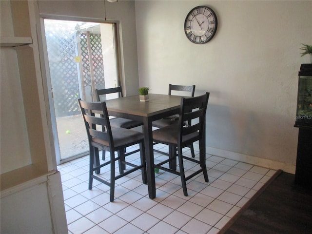 dining space with light tile patterned flooring