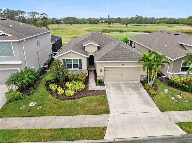 view of front of house with central AC unit and a garage