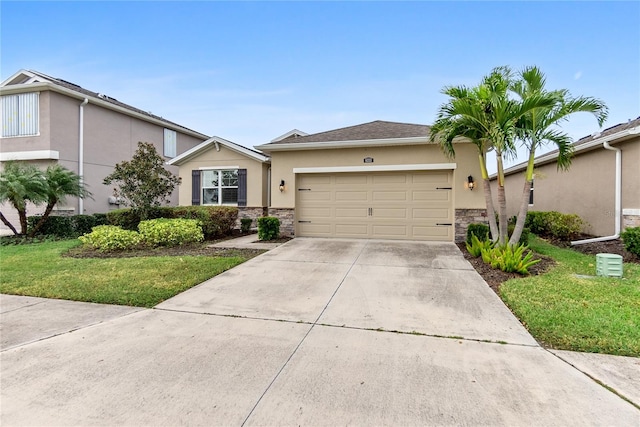 view of front of property featuring a garage and a front lawn