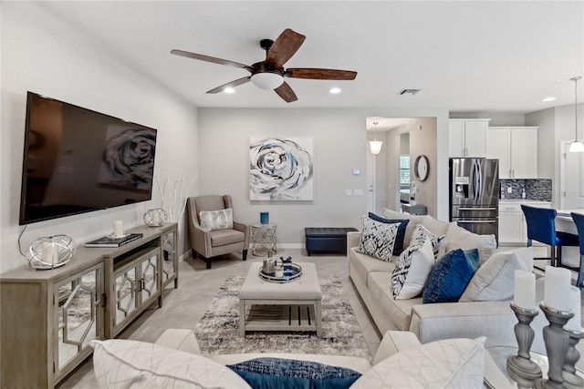 living room with ceiling fan