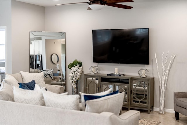 living room with ceiling fan and light wood-type flooring