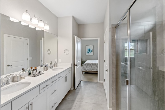 bathroom with tile patterned flooring, vanity, and walk in shower