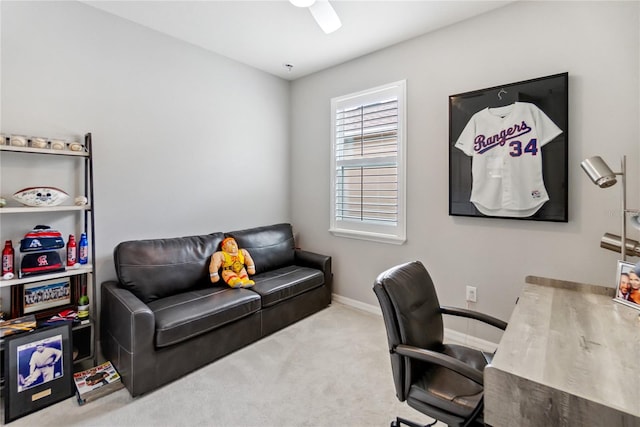 office space featuring ceiling fan and light carpet