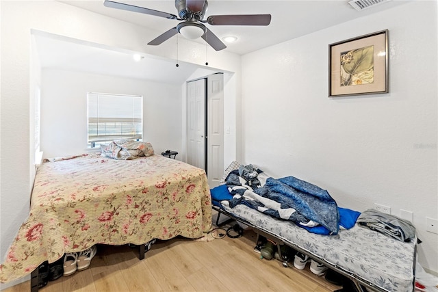 bedroom featuring a closet, ceiling fan, and hardwood / wood-style floors