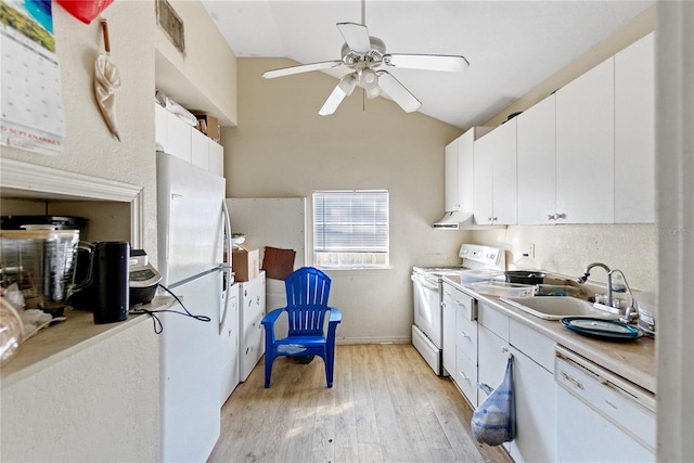 kitchen featuring white cabinetry, light wood-type flooring, white appliances, and vaulted ceiling