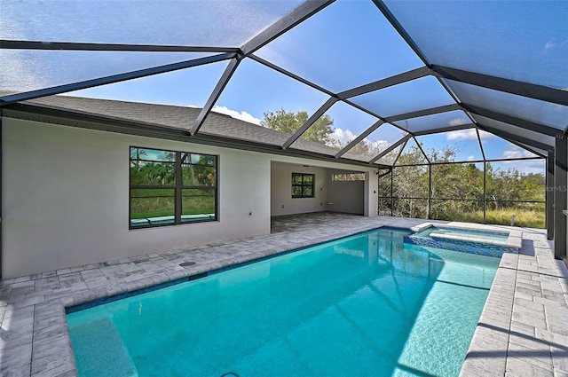 view of swimming pool featuring a lanai, an in ground hot tub, and a patio