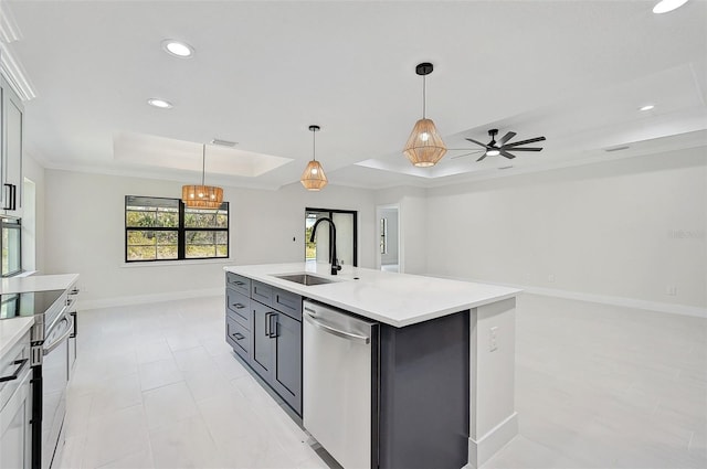 kitchen featuring a center island with sink, decorative light fixtures, sink, and stainless steel appliances