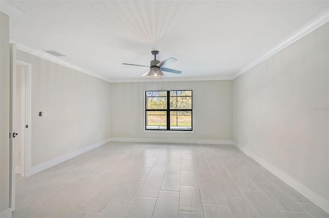 empty room featuring ceiling fan and crown molding