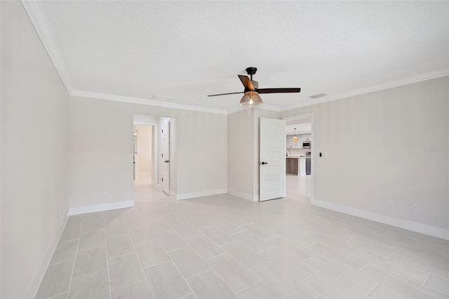 spare room with ceiling fan, crown molding, and a textured ceiling