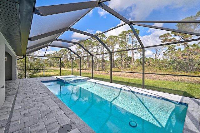 view of pool featuring a lanai, an in ground hot tub, and a patio