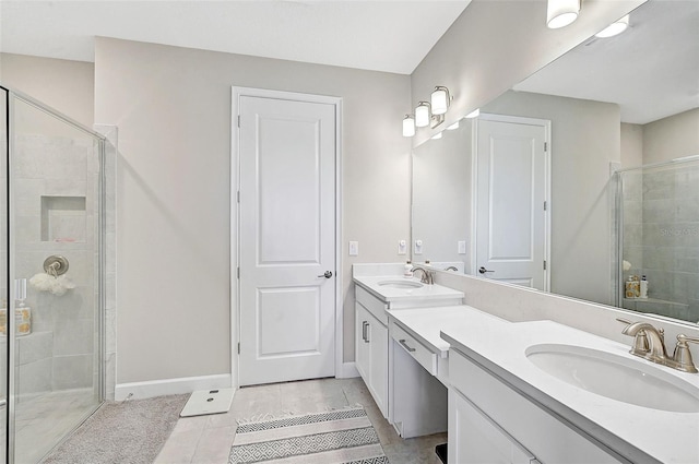 bathroom with tile patterned floors, vanity, and walk in shower