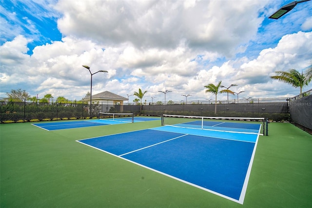 view of sport court with basketball hoop