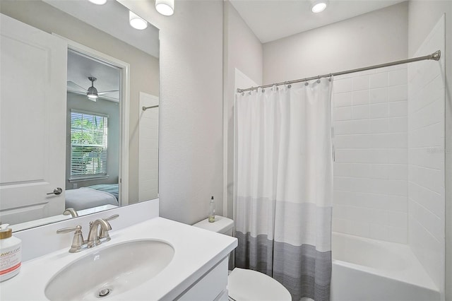 full bathroom with toilet, vanity, shower / tub combo with curtain, and ceiling fan