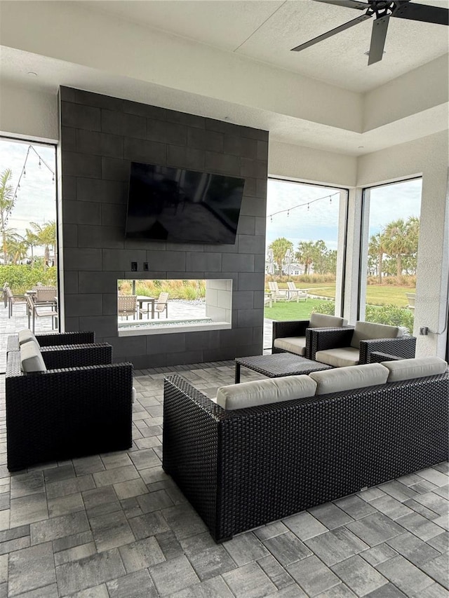 view of patio / terrace with ceiling fan and an outdoor hangout area