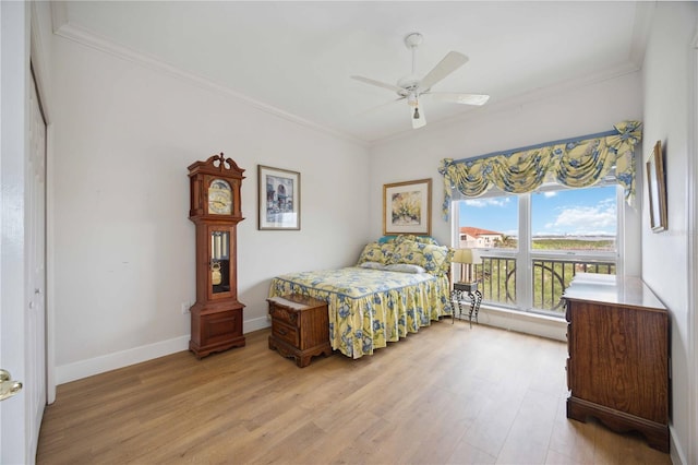 bedroom with light wood-type flooring, a closet, ceiling fan, and ornamental molding