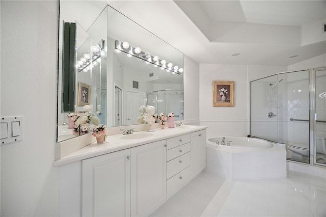 full bathroom with tile patterned flooring, vanity, separate shower and tub, and toilet