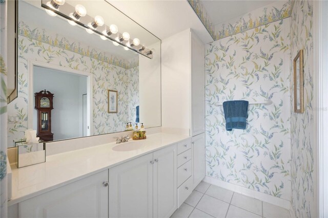 5450 Eagles Point Cir Unit 405, Sarasota, FL 34231 - full bathroom with wallpapered walls, vanity, tile patterned floors, and baseboards