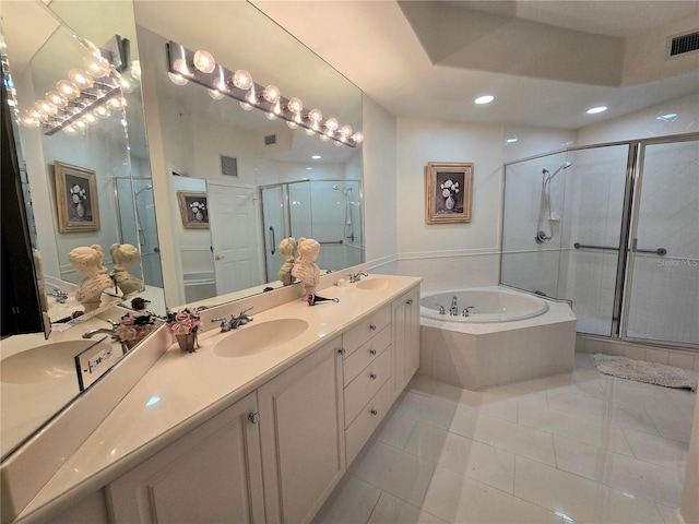 5450 Eagles Point Cir Unit 405, Sarasota, FL 34231 - full bathroom with double vanity, a bath, a stall shower, tile patterned floors, and recessed lighting