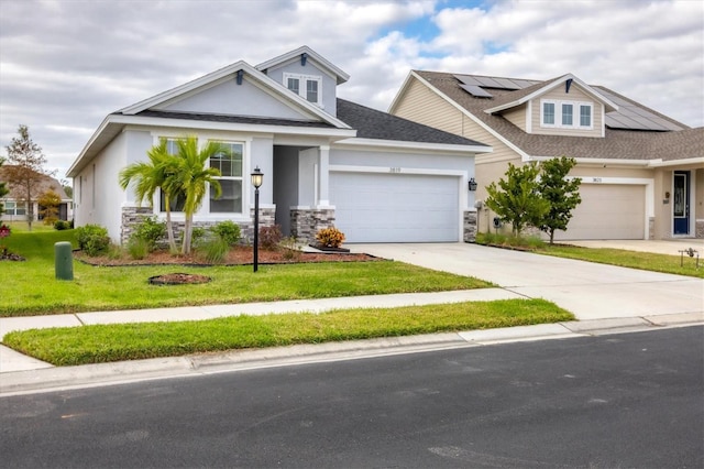 view of front facade with solar panels, a garage, and a front yard