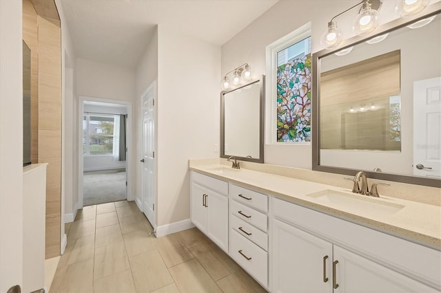 bathroom with tile patterned flooring and vanity