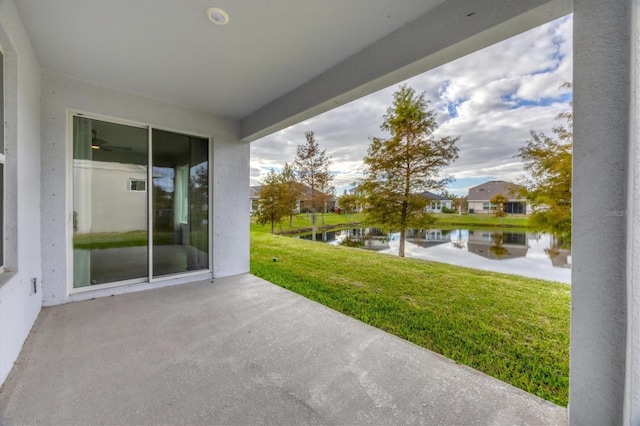 view of patio featuring a water view