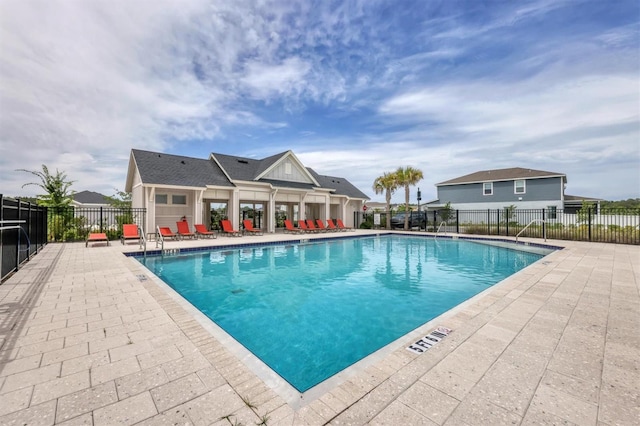 view of swimming pool with a patio