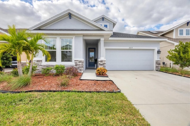 view of front of property featuring a garage and a front yard