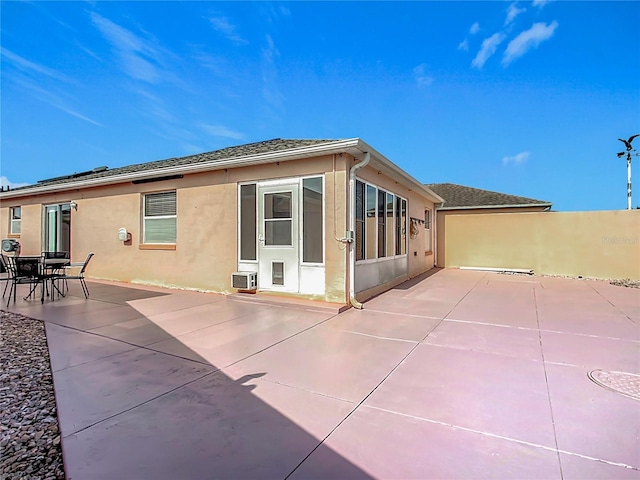 rear view of property featuring a patio area