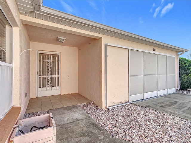 property entrance with a patio area