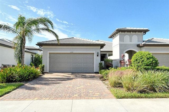 mediterranean / spanish-style house featuring a garage