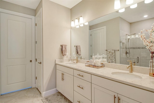 bathroom with a shower with door and vanity