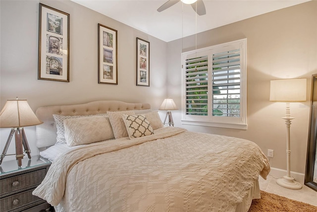 tiled bedroom featuring ceiling fan