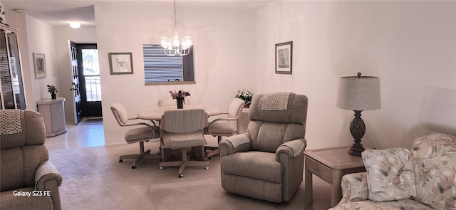 dining area featuring an inviting chandelier