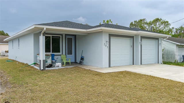 single story home with a front yard and a garage