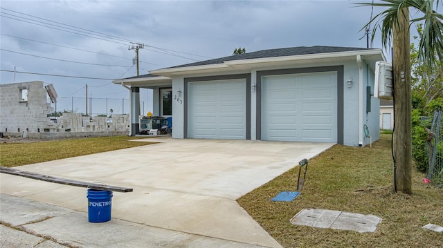 garage featuring a lawn