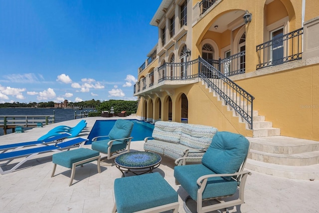 309 Ringling Point Dr, Sarasota, FL 34234 - view of patio featuring stairs, an outdoor pool, and an outdoor hangout area