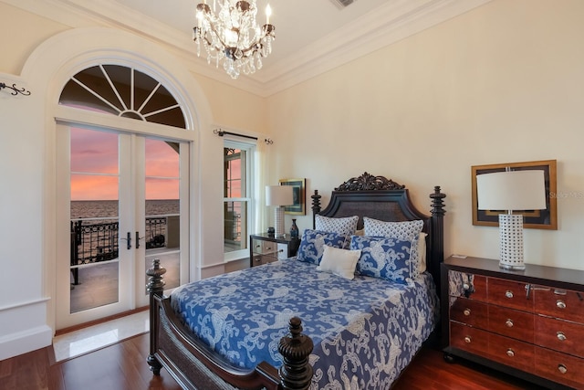 bedroom with access to exterior, french doors, ornamental molding, an inviting chandelier, and dark hardwood / wood-style floors